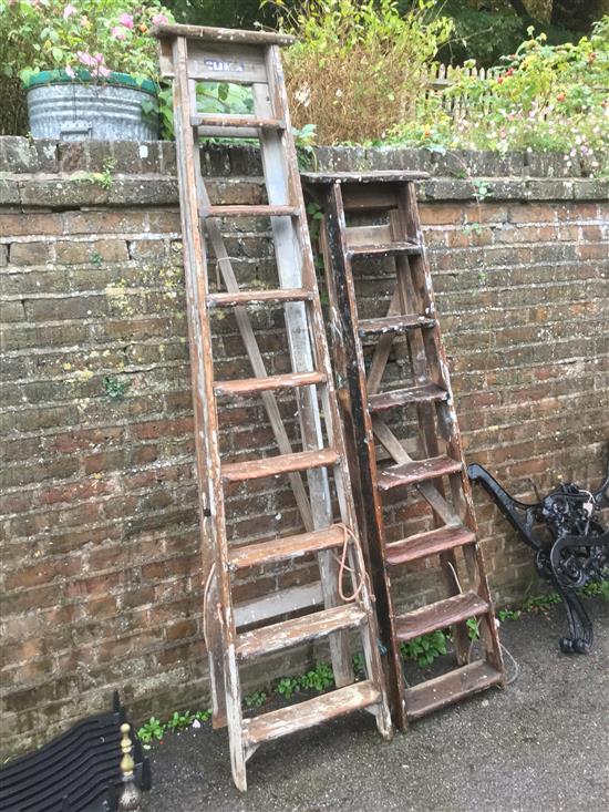 Two wooden step ladders